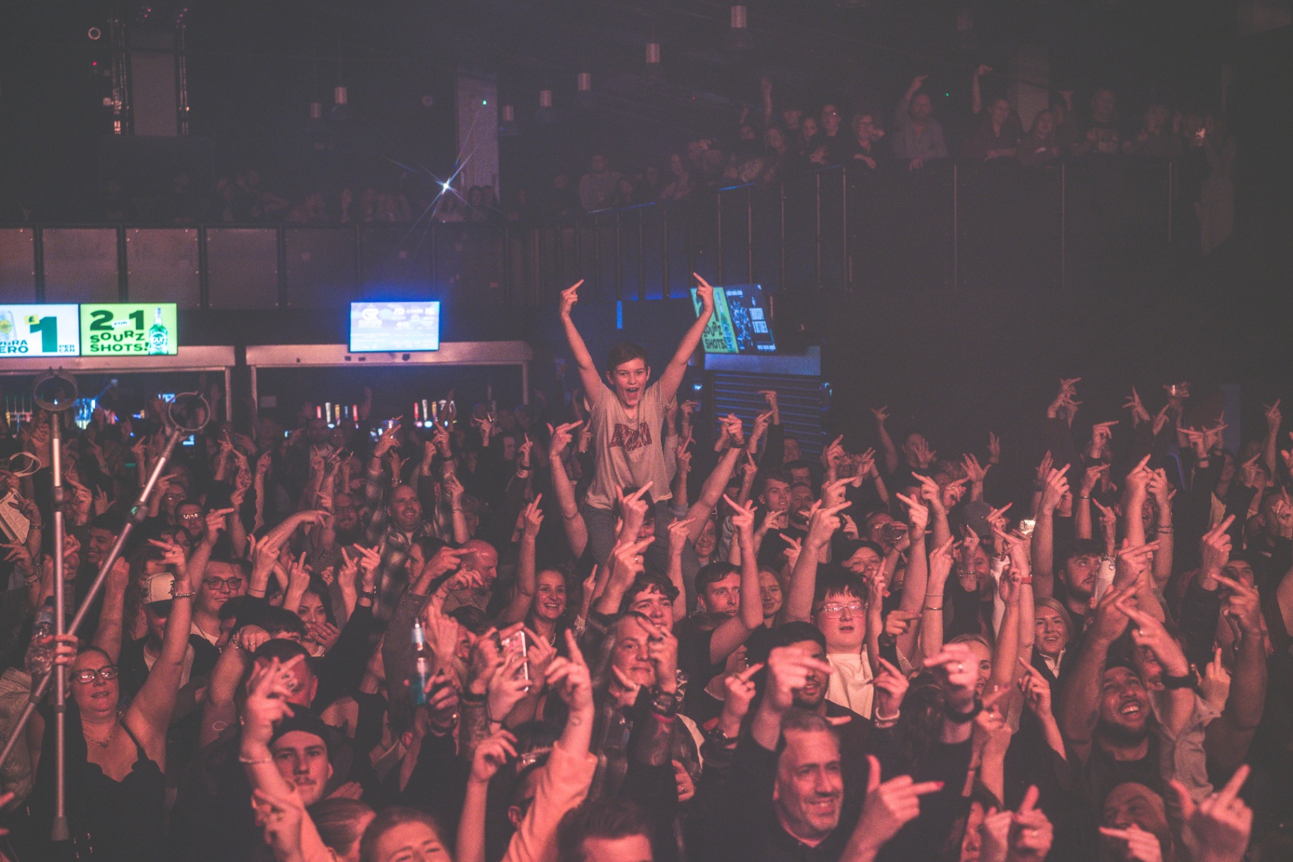 Crowd with hands up during the show